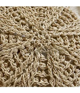 Detailed macro shot of the premium 3D radial woven texture on a straw crossbody bag