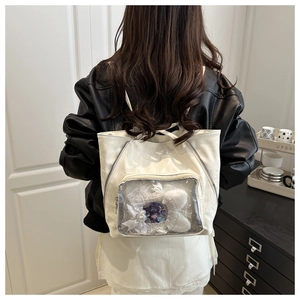 Detailed back view of a white leather Ita Bag with large clear window for badges