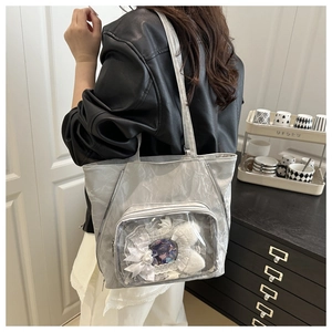 Silver ita bag showing transparent display window with anime badges and lace details