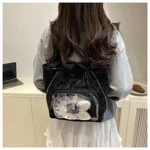 Detail of black pleated tote bag featuring a transparent display window for DIY decoration