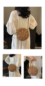 Detail showing natural straw round crossbody bag with boho tassels and woven texture