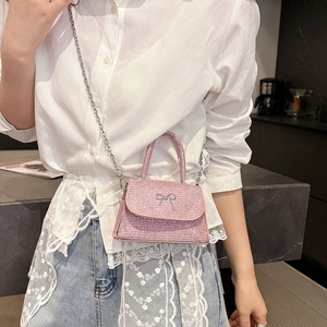 Sparkly pink mini crossbody bag with crystal bow and detachable chain shoulder strap