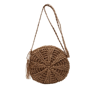 Chic dark brown circular straw woven shoulder bag with stylish tassel detail