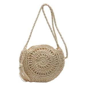 Handmade round straw shoulder bag with woven vortex texture and tassel detail