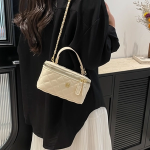 Chic beige quilted crossbody bucket bag with gold rose logo and chain strap for women