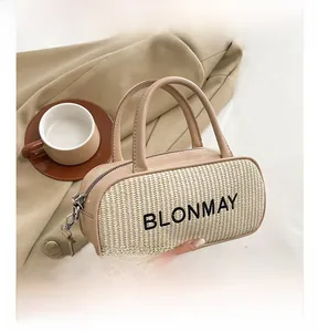 Detail of straw-textured small square bag with leather trim and BLONMAY embroidery