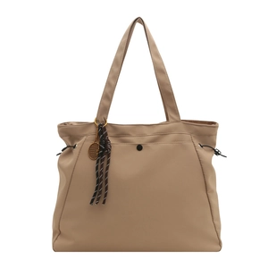 Large khaki tote bag with front pocket and adjustable side drawstrings for women