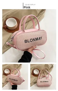 Pink leather and woven patchwork cylindrical bag with top handles and logo detail