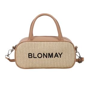 Minimalist beige woven handbag with brown leather trim and detachable shoulder strap