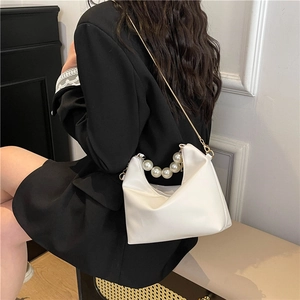 Elegant white leather handbag with faux pearl handle and gold chain strap for women