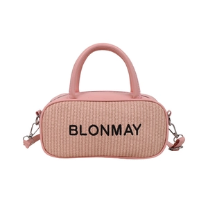 Pink woven pillow handbag with embroidered letters and faux leather details in front view