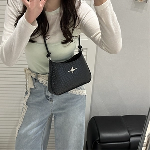Elegant black faux crocodile underarm bag featuring a metallic star charm and sleek strap