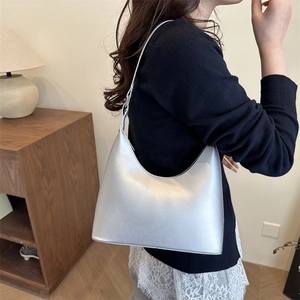 Minimalist silver metallic hobo shoulder bag with a sleek pearlescent finish for women