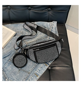 Close-up of black rhinestone chest bag with detachable round coin purse and wide strap