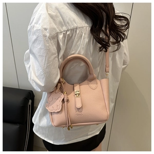 Pink lychee grain leather tote bag with metal lock and cute dog charm detail