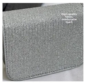 Macro view of premium silver glitter fabric and neat stitching on a small square bag