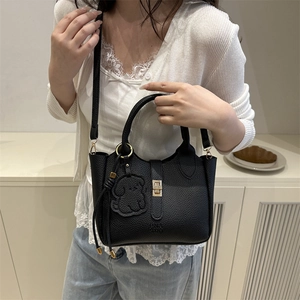 Large black lychee pattern leather tote bag with gold buckle and dog charm detail
