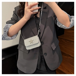 Mini borsa a tracolla argento glitterata con stella di strass e catena sottile in metallo