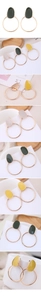 Macro detail of geometric round enamel earrings in Morandi colors with gold finish