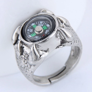 Detailed view of antique silver dragon claw ring with a black functional compass dial