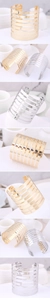 Close-up of polished gold and silver minimalist leaf-style wide hollowed open cuff bracelets
