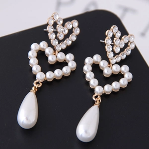 Elegant gold double heart earrings with crystal rhinestones and pearl drop accents