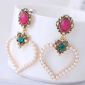 Vintage gold earrings with pink stones, emerald rhinestones, and pearl heart charms
