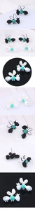 Detailed views of bee stud earrings with colorful enamel and sparkling rhinestones