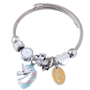 Silver bead bracelet with unicorn, heart charm, and letter A on a twisted wire band