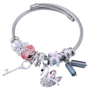 Adjustable stainless steel cable bracelet with crystal swan and key charms