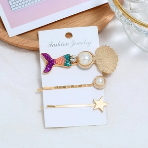 Lot de trois barrettes marines avec queue de sirène, perles et étoiles de mer dorées