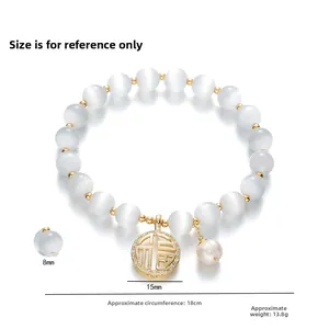 Bracelet en œil de chat avec pendentif doré caractère Fu et petite perle