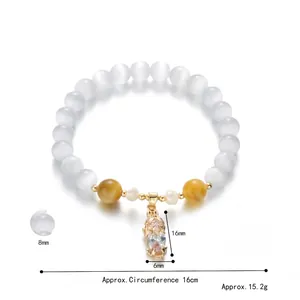 White cat eye stone bead bracelet with golden Pixiu charm and sparkling zircon pendant