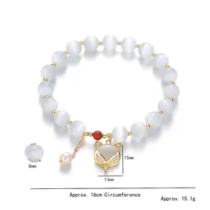Cat eye stone fox charm bracelet with freshwater pearls and gold metal accents