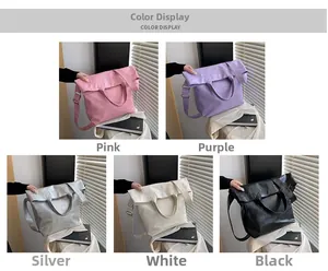 Detailed flat lay of soft leather tote bags in pink, purple, silver, white, and black