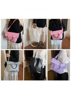 Close-up of stylish tote bags in five colors with textured leather and versatile straps