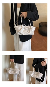 Detail of white PU leather handbag with elegant bow decoration and stylish shoulder strap