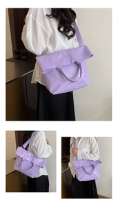 Detail view of the lavender faux leather tote bag showing the folded flap and side profile