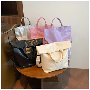 Collection of large capacity tote bags in silver pink purple black and beige leather