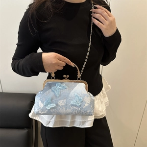 Light blue cheongsam bag with 3D butterfly embroidery and vintage kiss lock frame