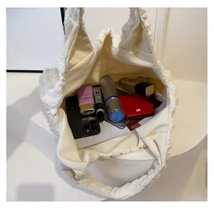 Interior view of large white bubble fabric tote bag showing spacious capacity for cosmetics