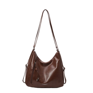 Retro brown oversized tote bag in glossy faux leather with tassel and zipper details