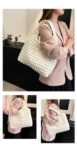 Close-up of white bubble texture fabric on a stylish nylon tote bag with pleated details