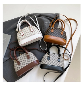 Detail view of retro shell handbags in four colors with classic patterned leather finish
