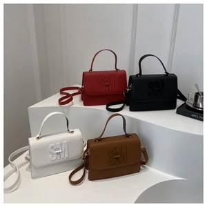 Detailed display of square crossbody bags in red, black, white, and brown with SM logos