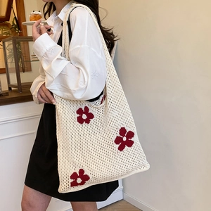 Fashionable hollow-knit tote bag with red flower motifs and large capacity shoulder design