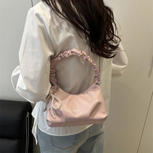 Chic pink pleated shoulder bag with pearl bow charm and chain strap for women