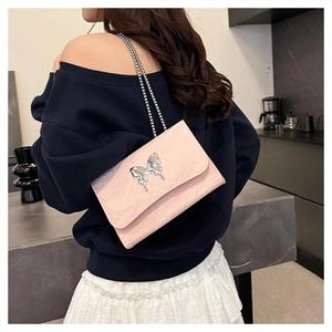 Pink pleated chain bag featuring a stylish silver fluid butterfly metal buckle detail