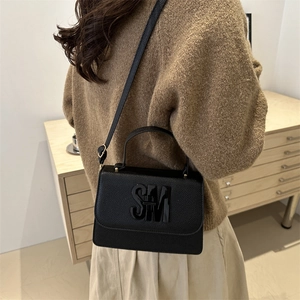 Minimalist black leather square bag with SM logo, crossbody and handheld style