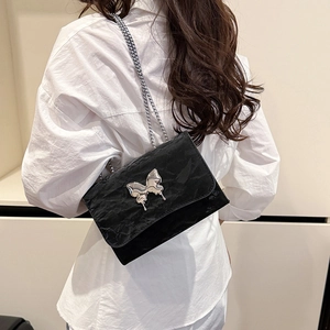 Elegant black wrinkled leather shoulder bag with silver butterfly buckle and chain strap